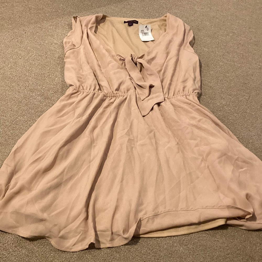 Front tie with peekaboo opening light tan dress.